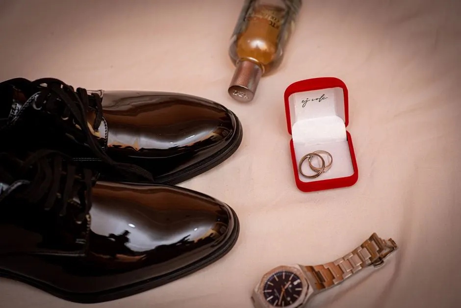 A selection of men's gold rings laid out for comparison