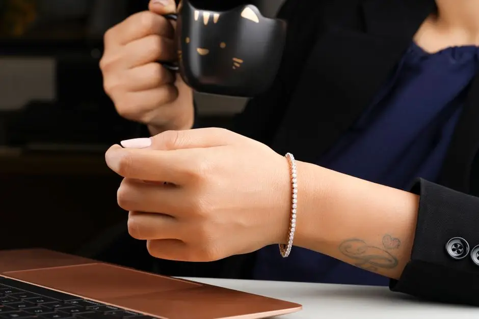 Diamond tennis bracelet on the wrist at everyday distance, where clarity grades vanish
